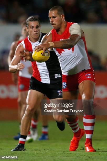 Jack Steele of the Saints chase down Lance Franklin of the Swans during the JLT Community Series AFL match between the St Kilda Saints and the Sydney...