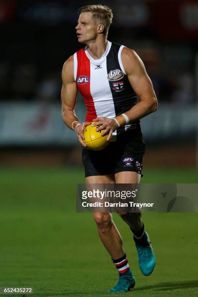 Nick Riewoldt of the Saints runs with the ball during the JLT Community Series AFL match between the St Kilda Saints and the Sydney Swans at...