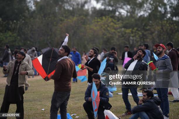 Pakistani kite flyers fly kites at a park in Islamabad on March 12 during the Basant Kite Festival which is traditionally celebrated in spring season...