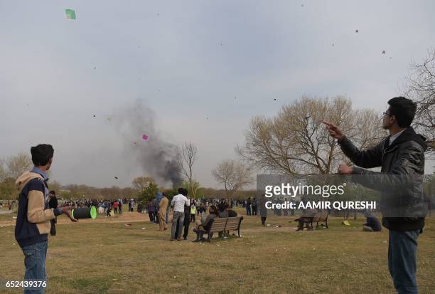 Pakistani kite flyers fly kites at a park in Islamabad on March 12 during the Basant Kite Festival which is traditionally celebrated in spring season...