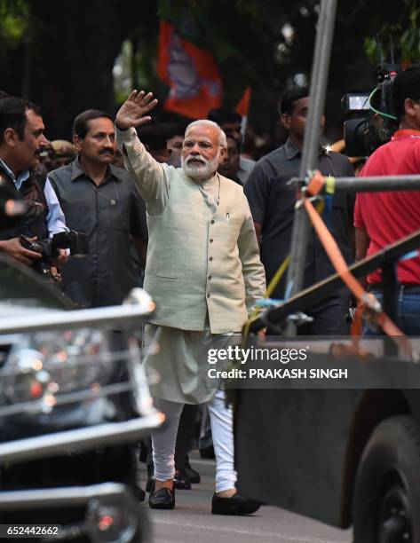 Indian Prime Minister Narendra Modi arrives at the Bharatiya Janata Party headquarters for a victory speech in New Delhi on March 12 a day after...