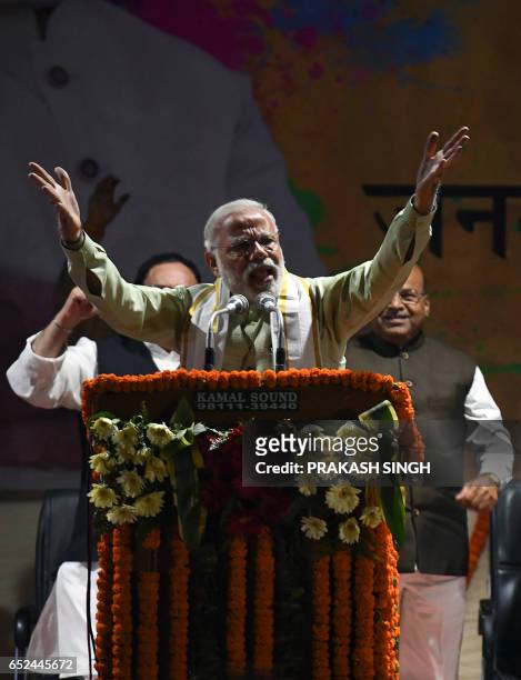 Indian Prime Minister Narendra Modi delivers a victory speech at the Bharatiya Janata Party headquarters in New Delhi on March 12 a day after votes...