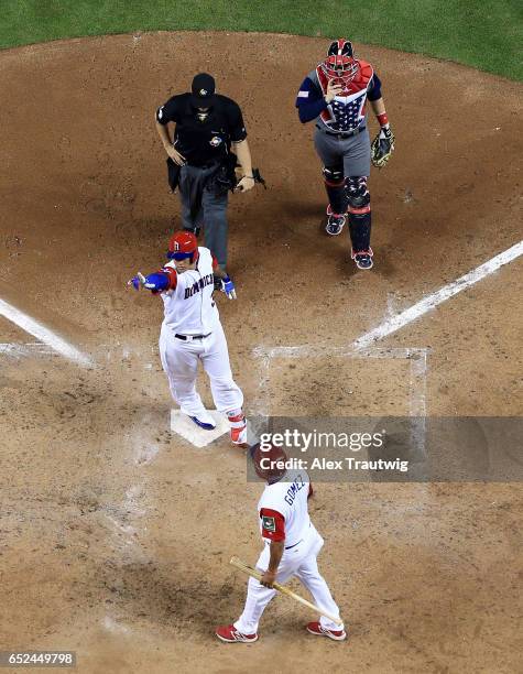 Manny Machado of Team Dominican Republic celebrates after hitting a solo home run in the sixth inning against Team USA during Game 4 of Pool C of the...