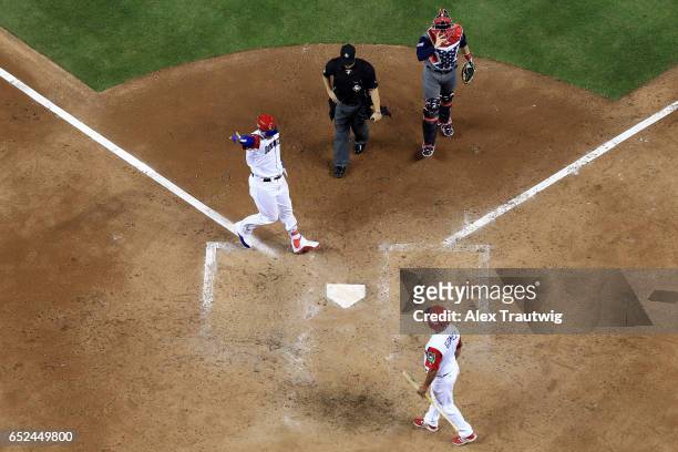 Manny Machado of Team Dominican Republic celebrates after hitting a solo home run in the sixth inning against Team USA during Game 4 of Pool C of the...