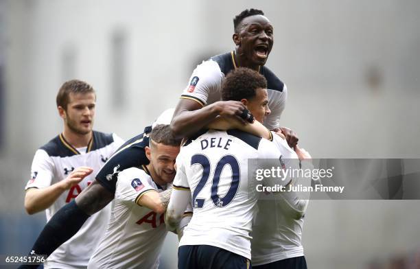 Christian Eriksen of Tottenham Hotspur celebrates scoring his sides first goal and his mobbed by Victor Wanyama of Tottenham Hotspur and team mates...