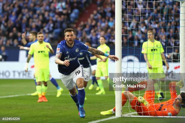 Guido Burgstaller of Schalke celebrates scoring the opening goal during the Bundesliga match between FC Schalke 04 and FC Augsburg at Veltins-Arena...