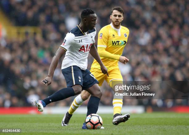 Victor Wanyama of Tottenham Hotspur is put under pressure from Lee Gregory of Millwall during The Emirates FA Cup Quarter-Final match between...