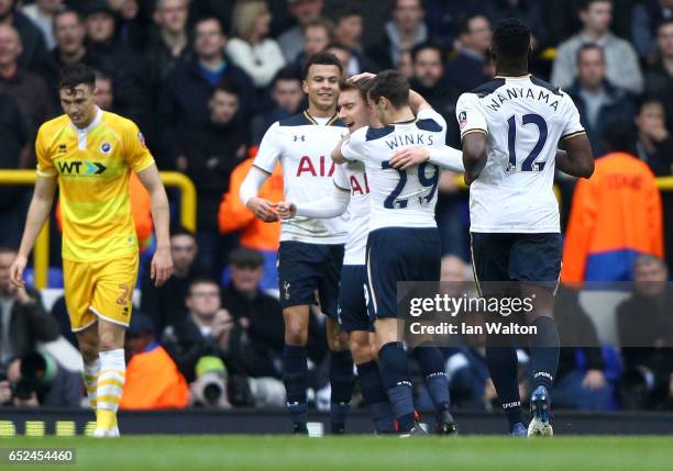 Christian Eriksen of Tottenham Hotspur celebrates scoring his sides first goal with his Tottenham Hotspur team mates during The Emirates FA Cup...