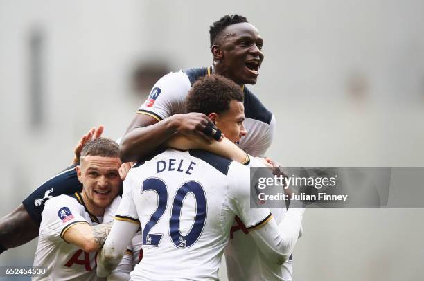 Christian Eriksen of Tottenham Hotspur celebrates scoring his sides first goal and his mobbed by Victor Wanyama of Tottenham Hotspur and team mates...