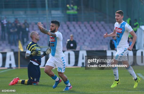 Napoli's Italian forward Lorenzo Insigne celebrates after scoring during the Italian Serie A football match SSC Napoli vs FC Crotone on March 12,...