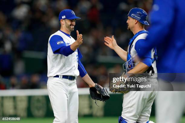 Josh Zeid and Ryan Lavarnway of Team Israel cerebrate after Israel defeated Team Cuba in Game 1 of Pool E of the 2017 World Baseball Classic at the...