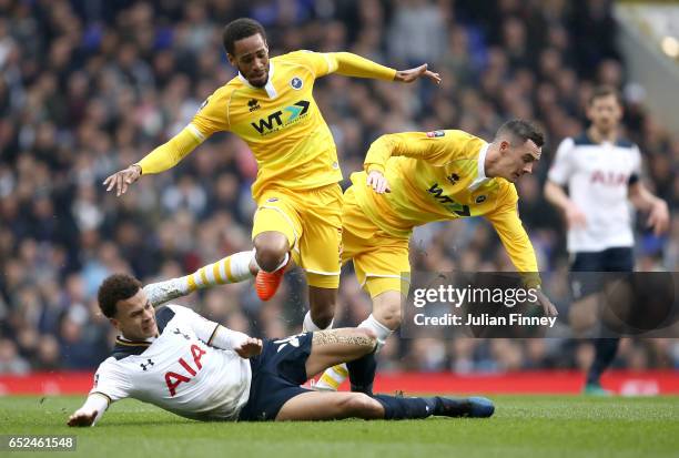 Dele Alli of Tottenham Hotspur , Shaun Cummings of Millwall and Shaun Williams of Millwall all battle to win the ball during The Emirates FA Cup...