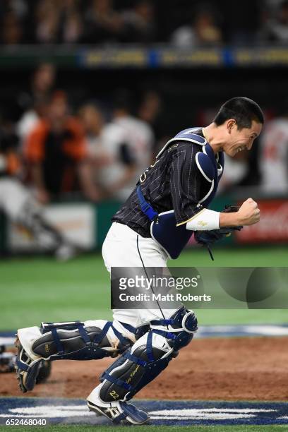 Catcher Seiji Kobayashi of Japan celebrates after catching a pop fly hit by Outfielder Kalian Sams of the Netherlands to win by 8-6 in the bottom of...