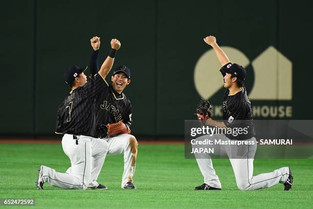 Outfielder Norichika Aoki, Outfielder Shogo Akiyama and Outfielder Seiya Suzuki of Japan celebrate their 8-6 victory after the World Baseball Classic...