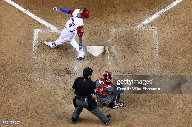 Manny Machado of the Dominican Republic hits a foul ball during a Pool C game of the 2017 World Baseball Classic against the United States at Miami...