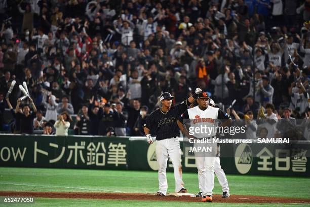 Infielder Sho Nakata of Japan celebrates hitting a two run single in the top of eleventh inning during the World Baseball Classic Pool E Game Two...