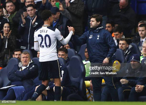 Dele Alli of Tottenham Hotspur shakes hand with Mauricio Pochettino manager of Tottenham Hotspur as he is substituted during The Emirates FA Cup...