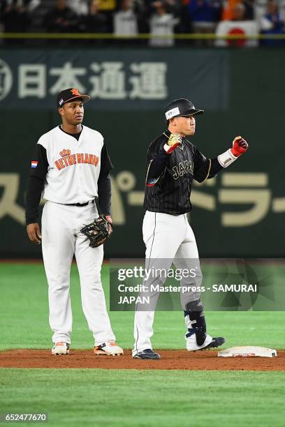 Pinch hitter Seiichi Uchikawa of Japan celebrates after hitting a double in the top of the tenth inning during the World Baseball Classic Pool E Game...