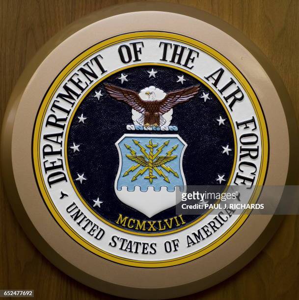 The Department of the Air Force seal hangs on the wall February 24 at the Pentagon in Washington,DC. AFP Photo/Paul J. Richards / AFP PHOTO / Paul J....