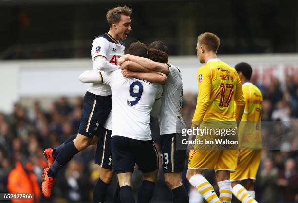 Vincent Janssen of Tottenham Hotspur celebrates as he scores their fifth goal with team mates during The Emirates FA Cup Quarter-Final match between...