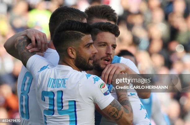 Napoli's Belgian forward Dries Mertens celebrates with Napoli's midfielder from Brazil Jorginho and Napoli's midfielder from Italy Lorenzo Insigne...