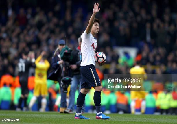 Hat trick scorer Heung-Min Son of Tottenham Hotspur celebrates with the match ball after The Emirates FA Cup Quarter-Final match between Tottenham...
