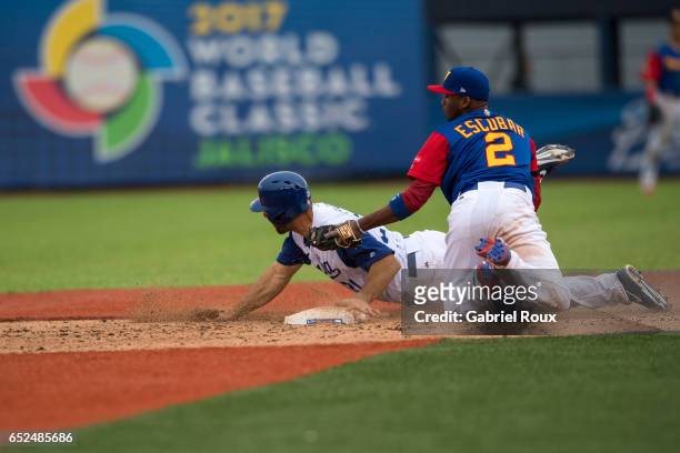 Alcides Escobar of Team Venezuela tags out Robert Segedin of Team Italy at second base during Game 3 Pool D of the 2017 World Baseball Classic on...
