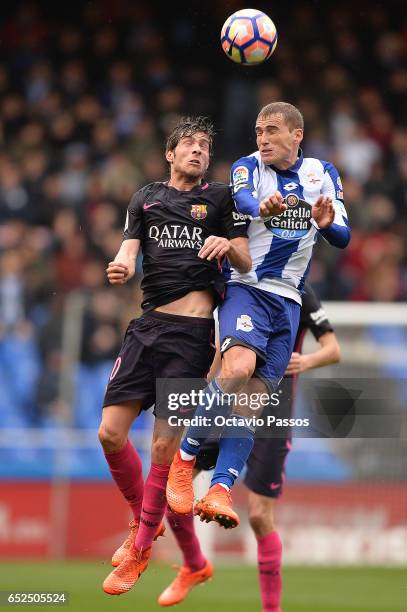 Alex Bergantinos of RC Deportivo La Coruna competes for the ball with Sergi Roberto of FC Barcelona during the La Liga match between RC Deportivo La...