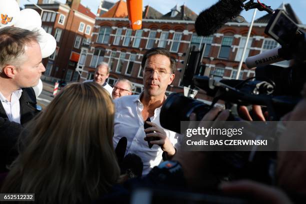 Dutch Prime Minister and leader of the People's Party for Freedom and Democracy Mark Rutte talks to the press during the CPC Run in The Hague, on...