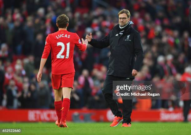 Lucas Leiva of Liverpool and Jurgen Klopp, Manager of Liverpool embrace after the Premier League match between Liverpool and Burnley at Anfield on...