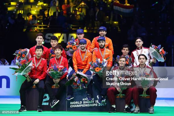 Team of China with the silver medal, Team of Netherlands with the gold medal and Team of Hungary with the bronze medal celebrate after the Men's 5000...