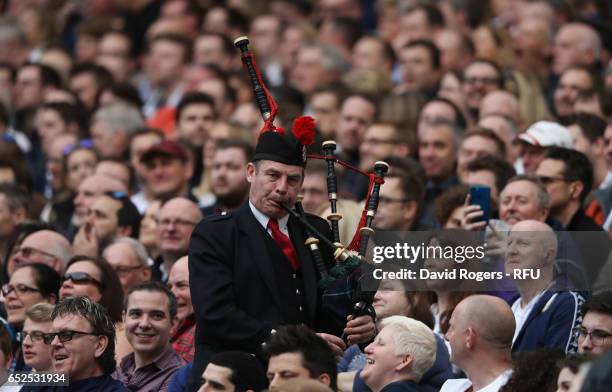 Scotland supporter plays the bagpipes during the RBS Six Nations match between England and Scotland at Twickenham Stadium on March 11, 2017 in...