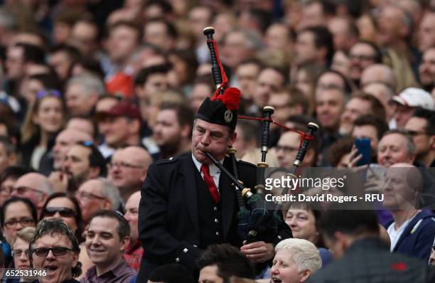 Scotland supporter plays the bagpipes during the RBS Six Nations match between England and Scotland at Twickenham Stadium on March 11, 2017 in...
