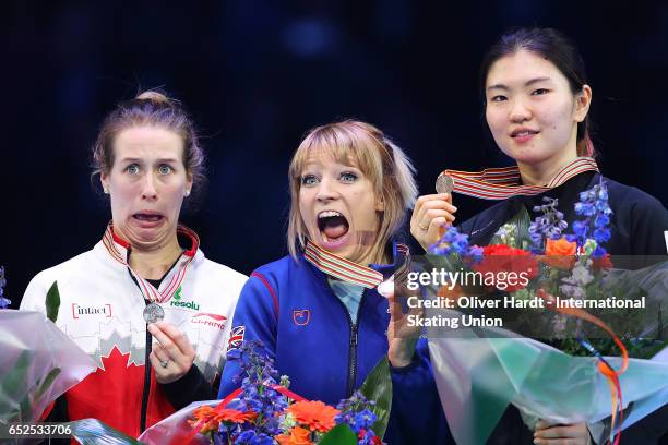 Marianne St Gelais of Canada with the silver medal, Elise Christie of Great Britain with the gold medal and Shim Suk Hee of Korea with the bronze...
