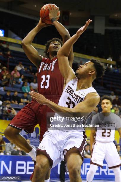 Jordon Varnado of the Troy Trojans shoots against Immanuel King of the Texas State Bobcats during the first half of a game in the final round of the...