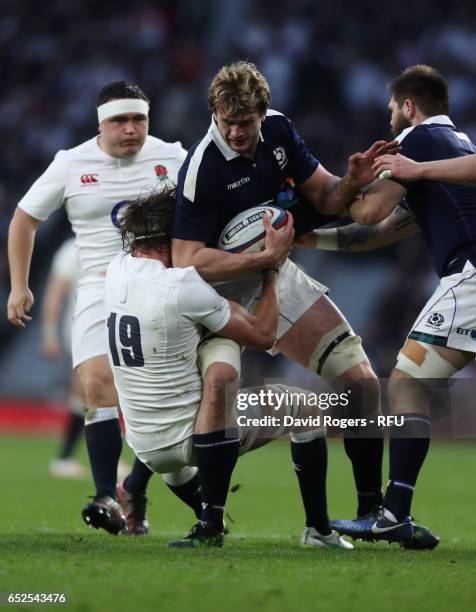 Richie Gray of Scotland is tackled by Tom Wood during the RBS Six Nations match between England and Scotland at Twickenham Stadium on March 11, 2017...