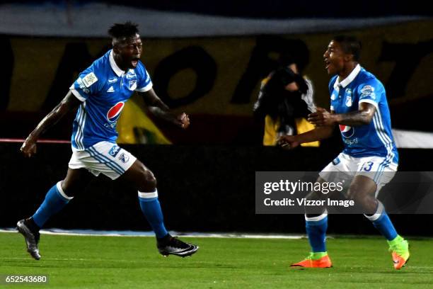 Duvier Riascos of Millonarios celebrates with teammate Harold Mosquera after scoring the first goal of his team during a match between Millonarios...