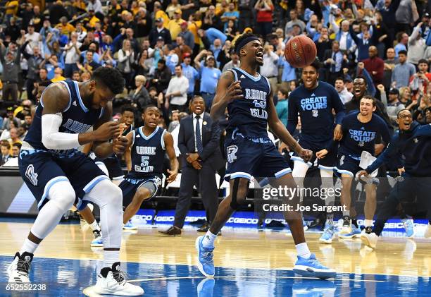 Stanford Robinson of the Rhode Island Rams celebrates after defeating the Virginia Commonwealth Rams 70-63 during the championship game of the...