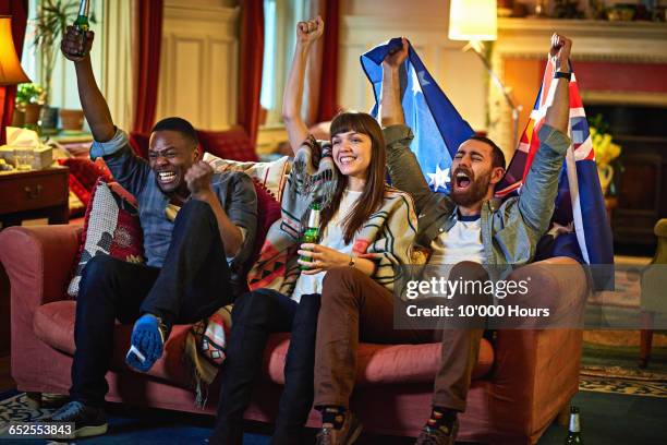 group of friends watching sport on the tv - australian culture stock pictures, royalty-free photos & images