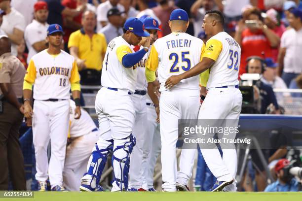 Ernesto Frieri of Team Colombia is greeted by teammates after getting out of a bases loaded jam in the 7th inning during Game 5 of Pool C of the 2017...