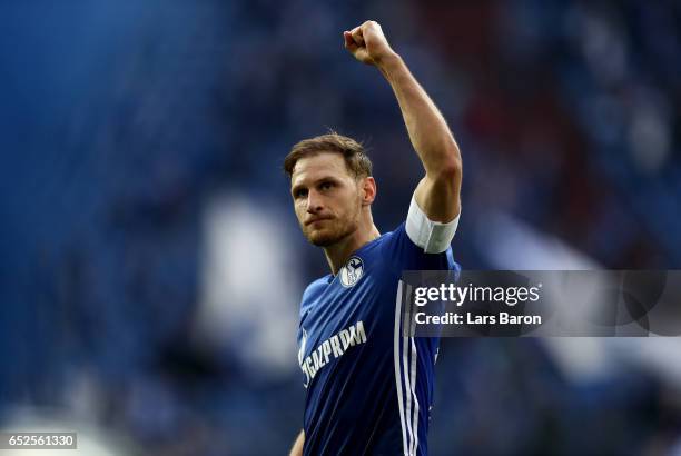 Benedikt Hoewedes of Schalke celebrates after winning the Bundesliga match between FC Schalke 04 and FC Augsburg at Veltins-Arena on March 12, 2017...