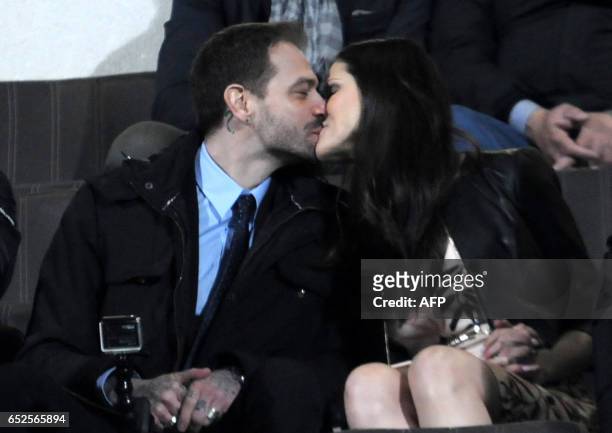 The president of Palermo's football club, Paul Baccaglini kisses partner Thais Wiggers in the stands before the Italian Serie A football match...