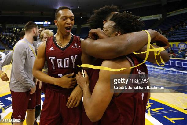 The Troy Trojans celebrate after the championship game of the Sun Belt Basketball Tournament against the Troy Trojans at UNO Lakefront Arena on March...