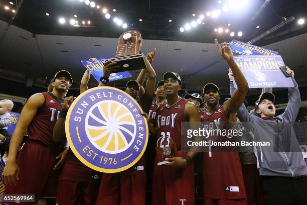 The Troy Trojans celebrate after the championship game of the Sun Belt Basketball Tournament against the Texas State Bobcats at UNO Lakefront Arena...