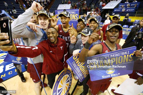 The Troy Trojans celebrate after the championship game of the Sun Belt Basketball Tournament against the Texas State Bobcats at UNO Lakefront Arena...