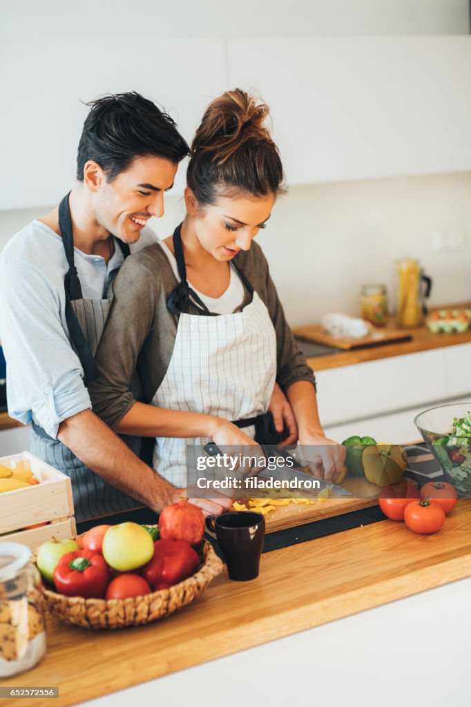 Young couple cooking in the kitchen