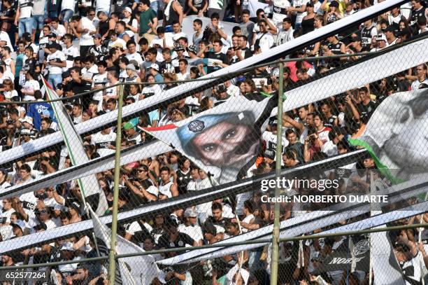 Fans of Olimpia cheer for their team before the start of Paraguayan Apertura 2017 football derby against Cerro Porteno at the Defensores del Chaco...