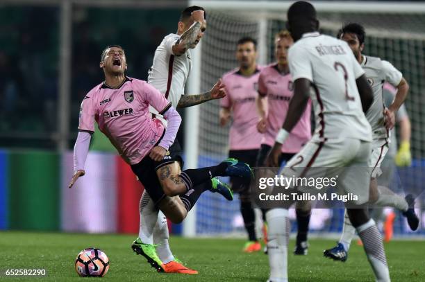 Leandro Paredes of Roma fouls Alessandro Diamanti of Palermo during the Serie A match between US Citta di Palermo and AS Roma at Stadio Renzo Barbera...