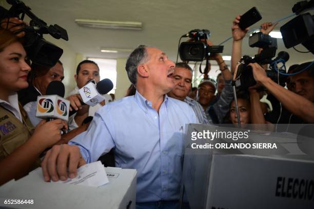 Tegucigalpa's mayor Nasry Juan Asfura Zablah, of the Partido Nacional ruling party, votes during the primary election in Tegucigalpa, on March 12,...