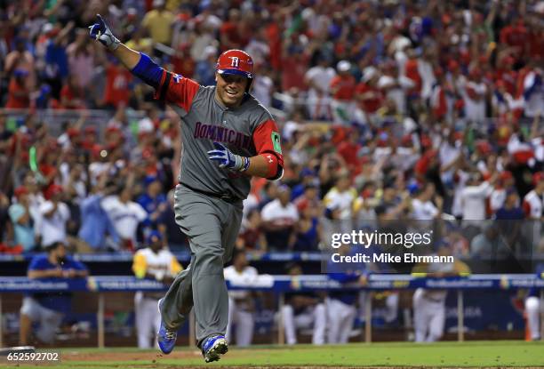 Welington Castillo of the Dominican Republic hits a 2 run single in the 11th inning during a Pool C game of the 2017 World Baseball Classic against...